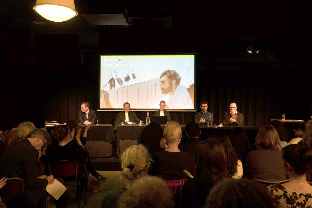 'Refugee on trial 'performance at Pakhuis de Zwijger Amsterdam 26 Nov. 2019. left to right. Frans William Verbaas(IND)-Teun van Os (Judge) Frederica van Straelen (clerk)Ehsan Fardjadniya(Artists, director-as Ali J)Hans van Zundert(Ali-J lawyer).